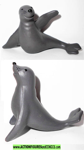 Rudolph 2001 CHRISTMAS SEALS island of toys playing christmas mantis